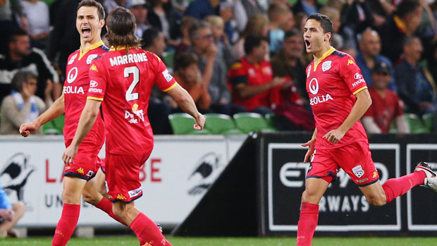 Adelaide United players celebrate a goal in their 2-0 win over City.