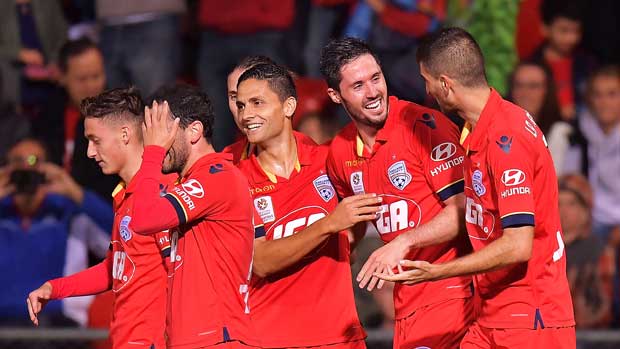 Adelaide United players celebrate Dylan McGowan's goal against the Wanderers on Saturday night.