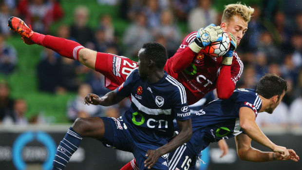 Melbourne Victory goalkeeper Lawrence Thomas makes an athletic save at AAMI Park.