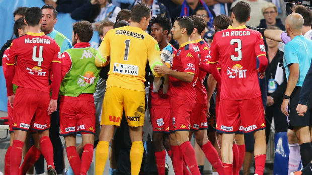 Adelaide United and Melbourne City players heading to the sheds at half-time on Friday night.